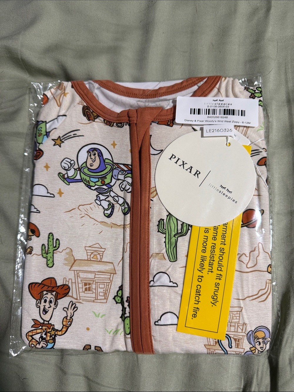 Little Sleepies Toy Story One-Piece Footie in Cream and Brown Trim
